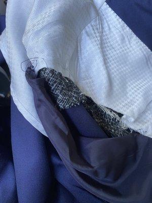 Suit lining that was destroyed (you can tell it was stitched at one point)