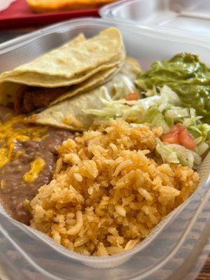 Carnitas street tacos with rice and beans