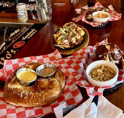 Schnitzel sandwich, beer brat, loaded potatoes, pretzel.