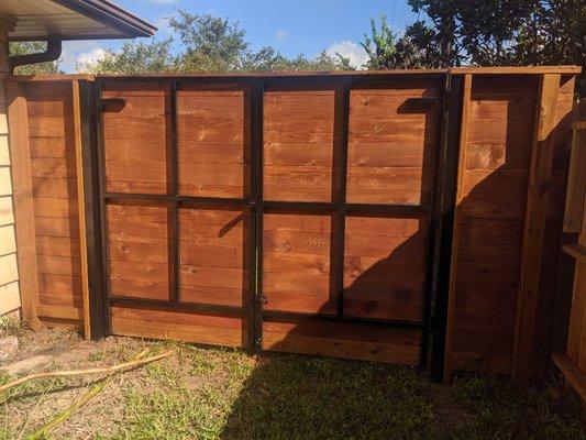 Double wood gate with steel frame.