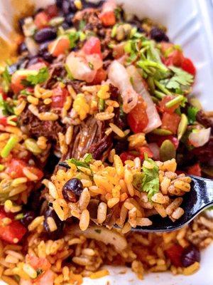 beef barbacoa bowl over rice - showing the rice