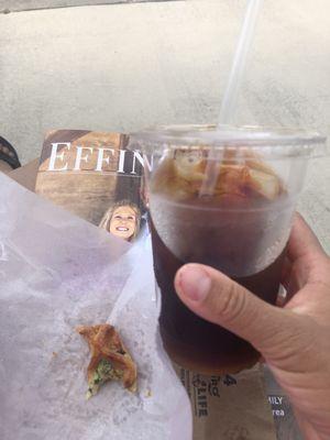 Cold brew coffee and a bite of the yummy spinach & feta pastry