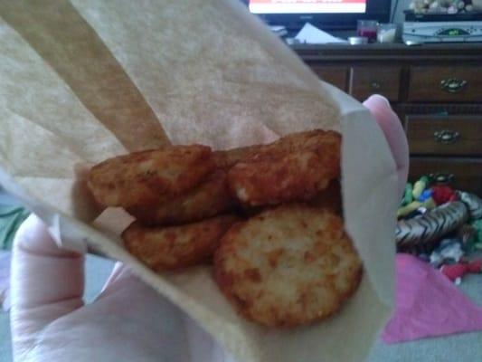 This is what an orderof hashbrowns looks like. The bag is less than half full. There is a total of five and a half pieces.