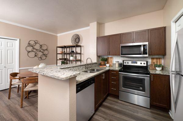 Kitchen with stainless steel appliances at Crescent Cove at Lakepointe