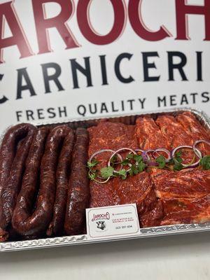 (left to right) Made In-House Dry Spicy Chorizo, Marinated Flap Meat Ranchera, Marinated Short Ribs.