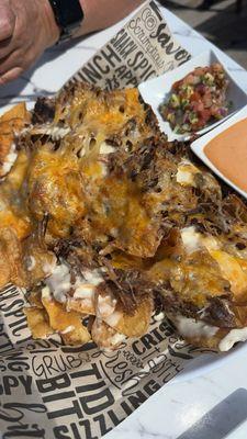 Nachos....these are the bomb! They don't get soggy at all. Got pico and sauce on the side sauce is yum o!