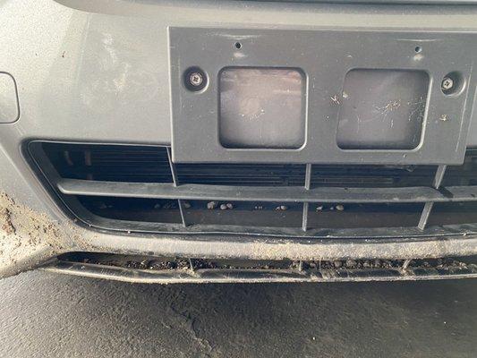 dent on bottom bumper, scratches