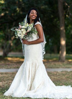 A bride in a white dress holding a bouquet