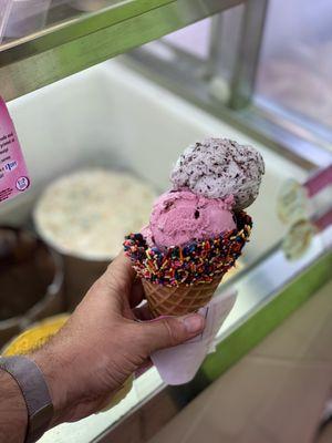 Three scoops in a rainbow waffle cone