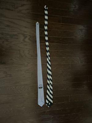 The size example tie (striped) and the tie they made 4" too short.