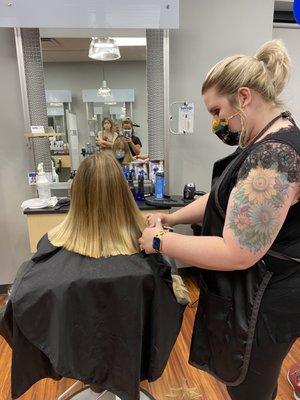 My daughter getting her ends trimmed and adding in some long layers. She loved her haircut.