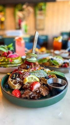 "Hat Yai" fried chicken and vanilla waffle ( Southern Thai style chicken) with fruits and maple syrup