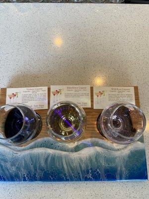 Liqueur flight: violet, elderflower, and wild rose. All delicious!!