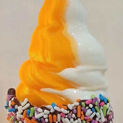 Orange Sorbet & Vamilla Ice Cream on a Sprinkle Waffle Cone.