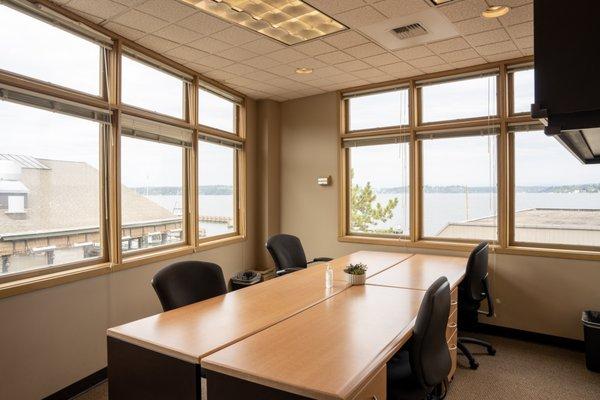 Office suite with four desks overlooking Lake Washington.