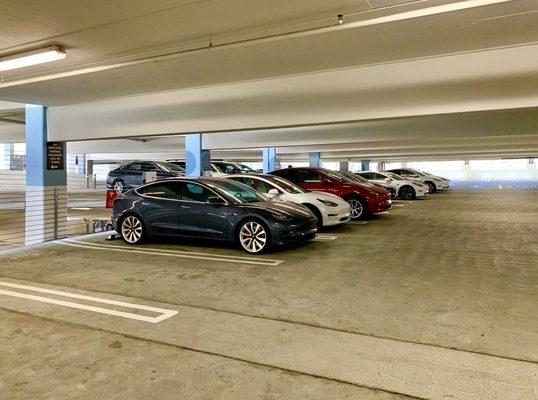 Tesla Supercharging Station inside the multi level parking garage....12 bays.