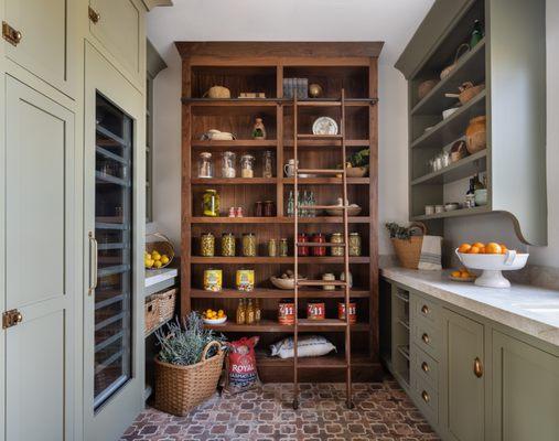 A gorgeous back kitchen we designed features a geothermal, non mechanical solution for root storage called a California Cooler.