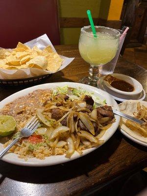 Once again, the usual: pork carnitas with homemade hot sauce and a margarita