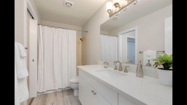 Bathroom with sparkling white quartz countertop