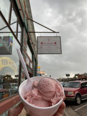 Strawberry ice cream, and the sign in the background.