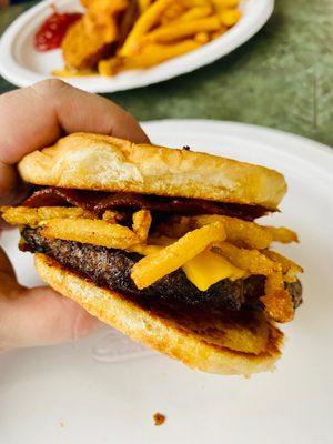 Western burger with bacon, onion straws and bbq sauce at the Poolside cafe.