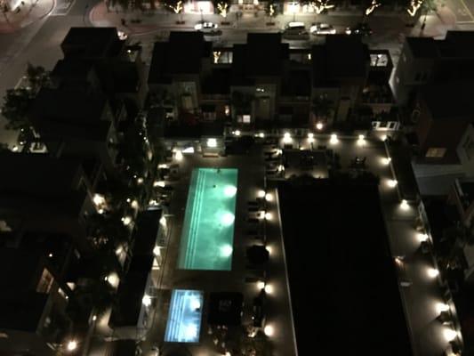 Pool and hot tub view at night from balcony