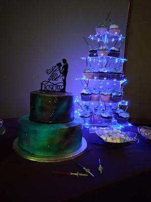 Our Star Wars cake and cupcakes. Blue LED cupcake stand and lightsaber pics were purchased on Amazon.