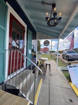 Front porch area has two tables