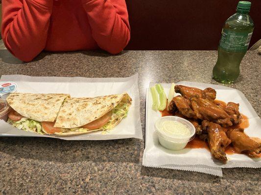 The best buffalo wings in town. And them quesadillas look delicious. Friendly environment