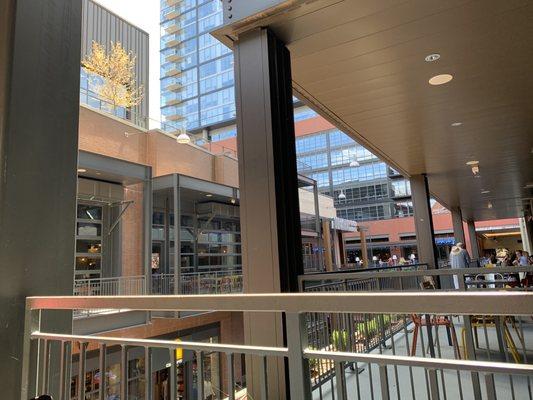 Outside seating on the bridge connecting the two sides of Assembly Food Hall