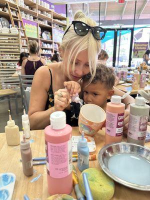 Mom making a mug with our birthday boy!