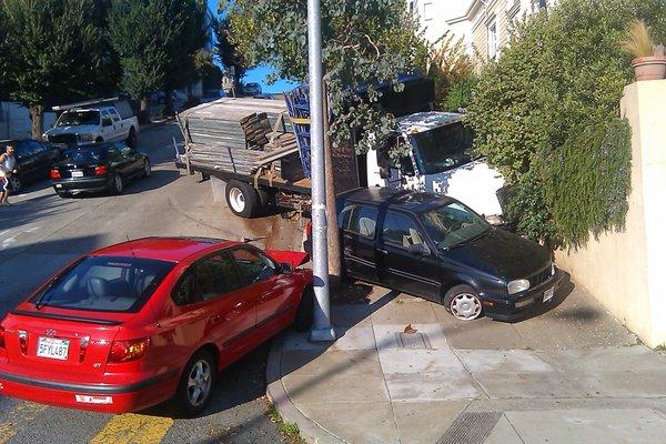 A truck lost control down a steep hill in San Francisco.