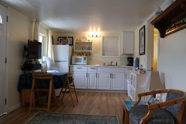 Across from the living room is our small kitchen, microwave, fridge, coffee-maker, sink, dishes for you.