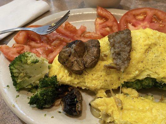 Showing the size and fresh mushrooms broccoli and sausage that was in my omelette.