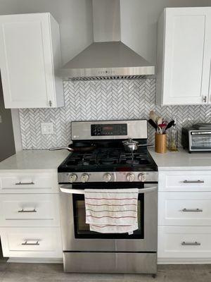 Marble herringbone backsplash