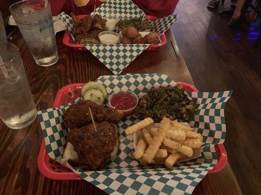 Hot chicken, French fries, greens, hush puppies and green beans.