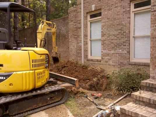 Making repairs to a water line.