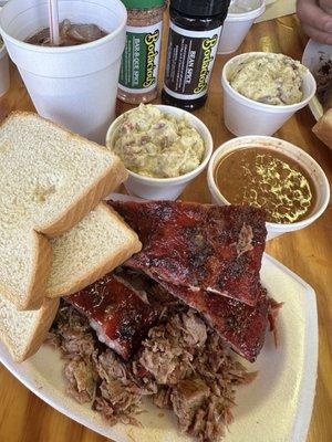 Combination plate with chopped beef, ribs, beans and potato salad with sweet tea ! (Also got seasoning)