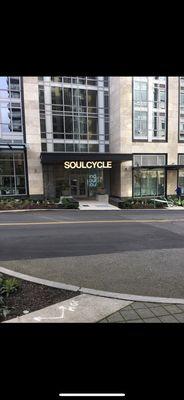 Facade of SoulCycle SLU from across the street