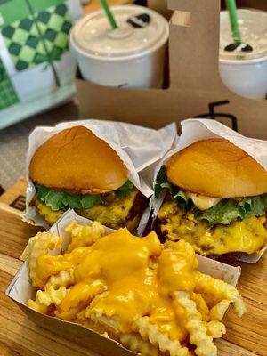 Cheese burgers and cheese fries strawberry malt shake.