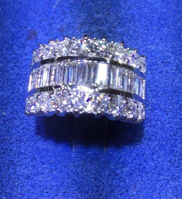 18 kt white gold and 3 1/2 carats total weight of diamonds.