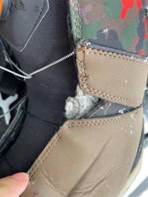 Torn out lace on snowboard boot