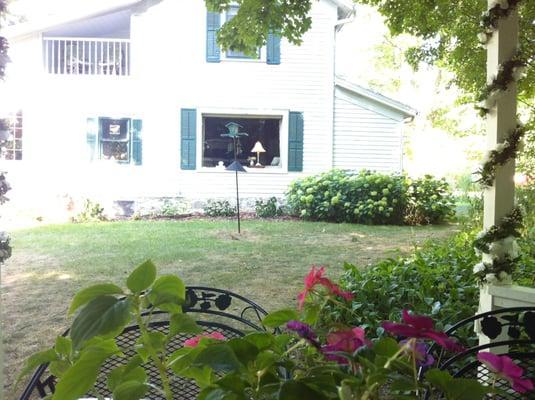 The main house.  View of living room window and private balcony from one of the upstairs guest rooms