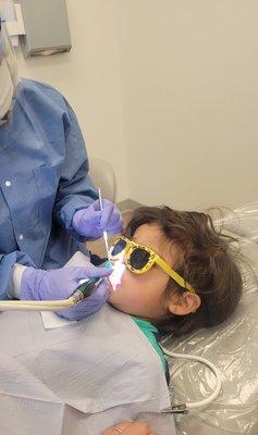 Looking cool while getting his teeth cleaned by the hygienist.