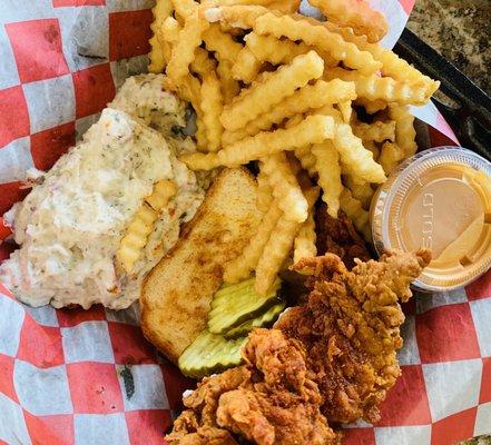 Two tenders (stacked), Texas toast, pickles, potato salad and fries.