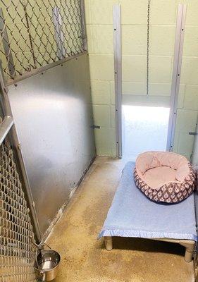 Inside our annex runs the dogs have a small metal hanging water bucket, a small raised cot, and bedding.