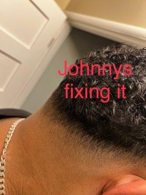 Johnny's Barbershop fixing the fade.