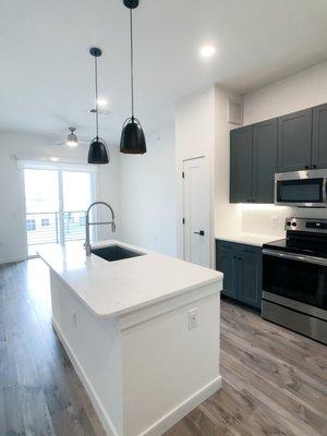 Domain apartment with W/D, built-in mudroom, and hexagonal backsplash.