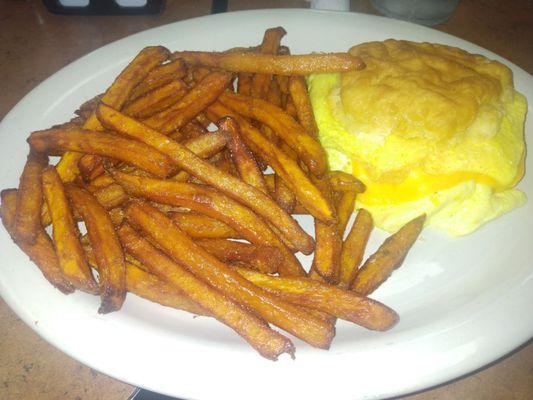 Egg and cheese biscuit with sweet potato fries.