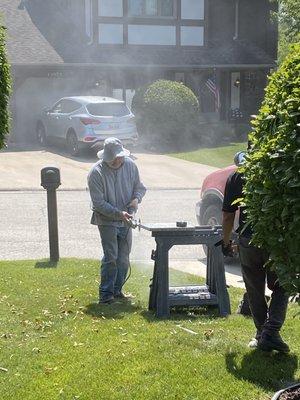 Martin cutting some edges on site.